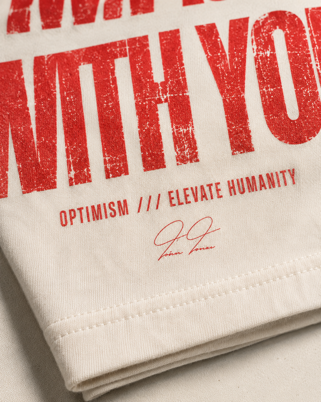 Close detail of the distressed red print, OPTIMISM footer and Trevor Thomas signature.
