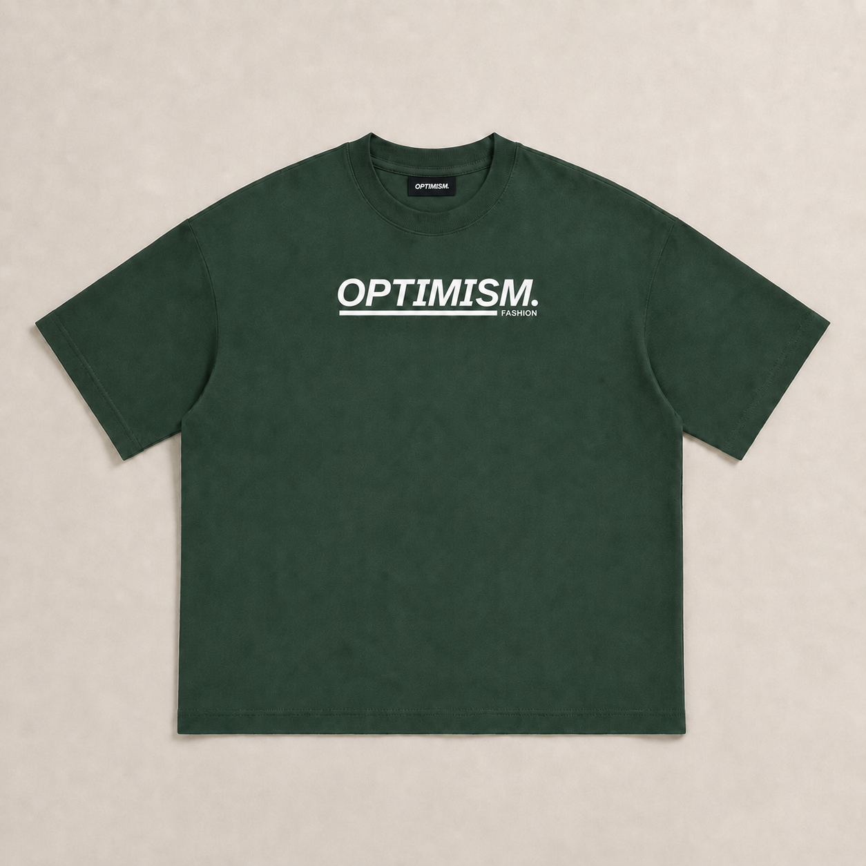Front of the OPTIMISM. Can't Afford oversized T-shirt in Private Green with white chest wordmark.