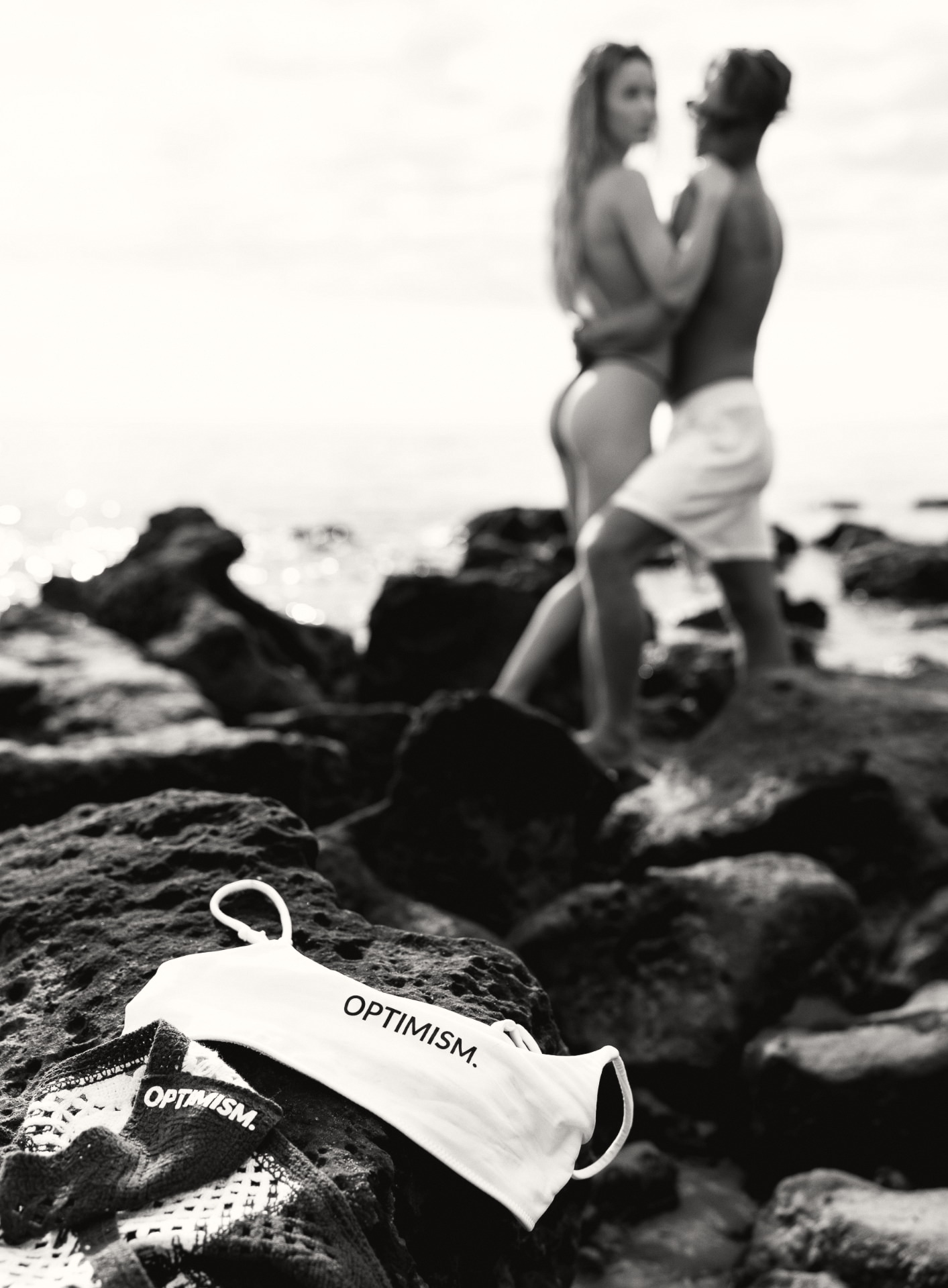OPTIMISM. archive — Garments left on stone. The pair out of focus behind.