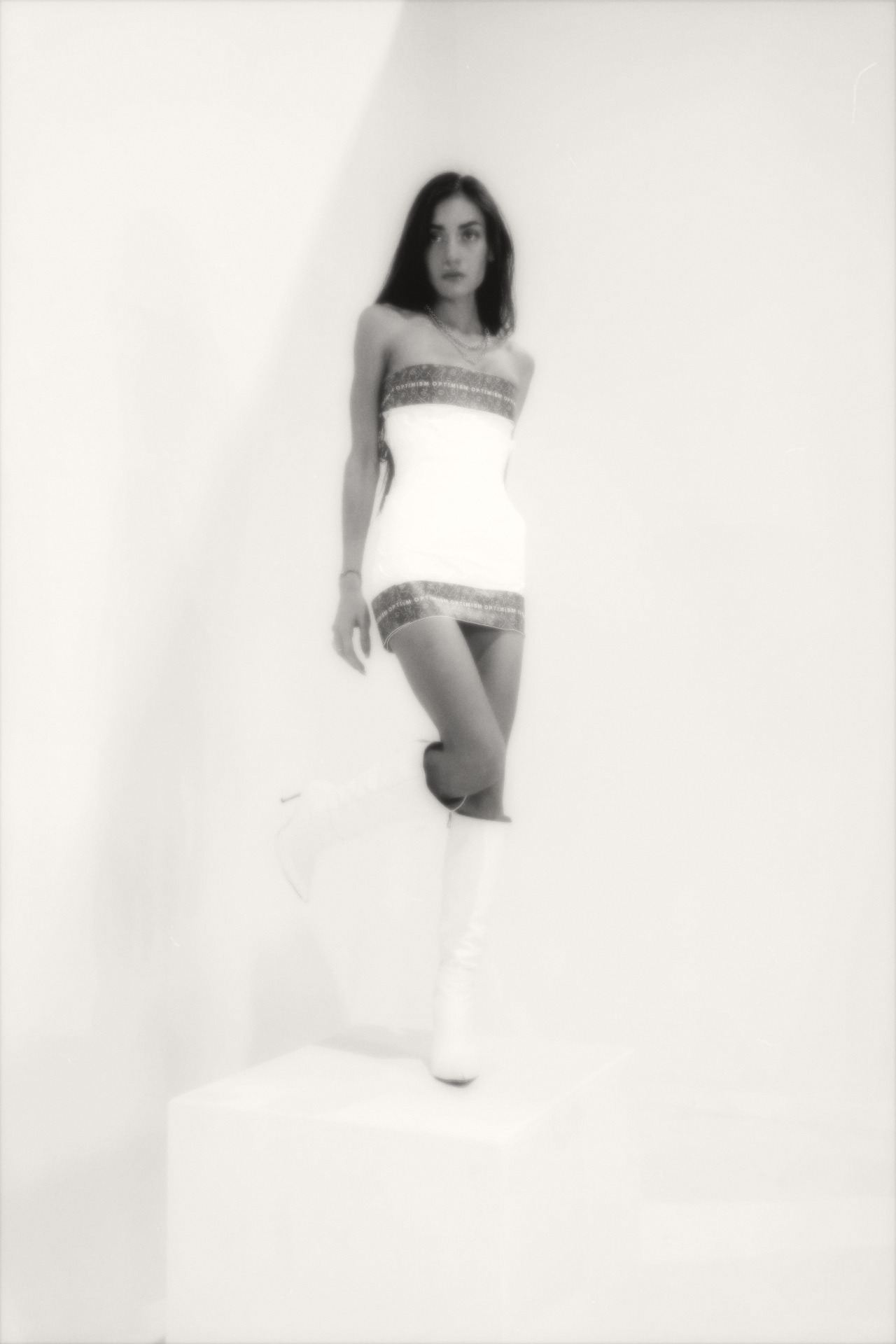 OPTIMISM. archive — Bandeau mini study. White ground, tall boot.